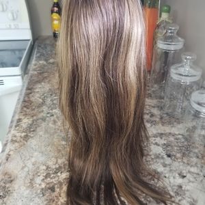 Brand new layer wig with some blonde highlights.